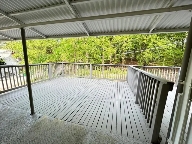 a view of balcony with wooden floor
