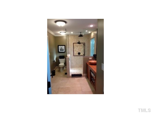 2935 Rue Sans Famille Raleigh, NC 27607 - Photo 5 of 5 a en suite bathroom with a sink and a mirror