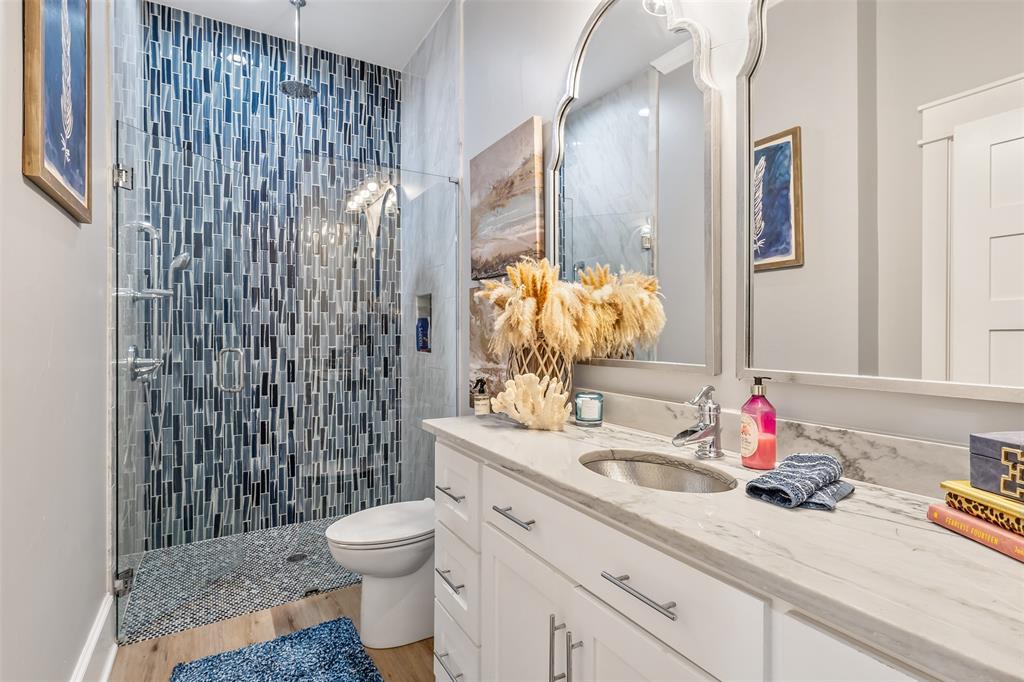 16241 Big Oak Bay Road Tyler, TX 75707 - Photo 23 of 40 Glass-enclosed shower featuring blue and gray mosaic tile, rain shower head, and polished chrome fixtures