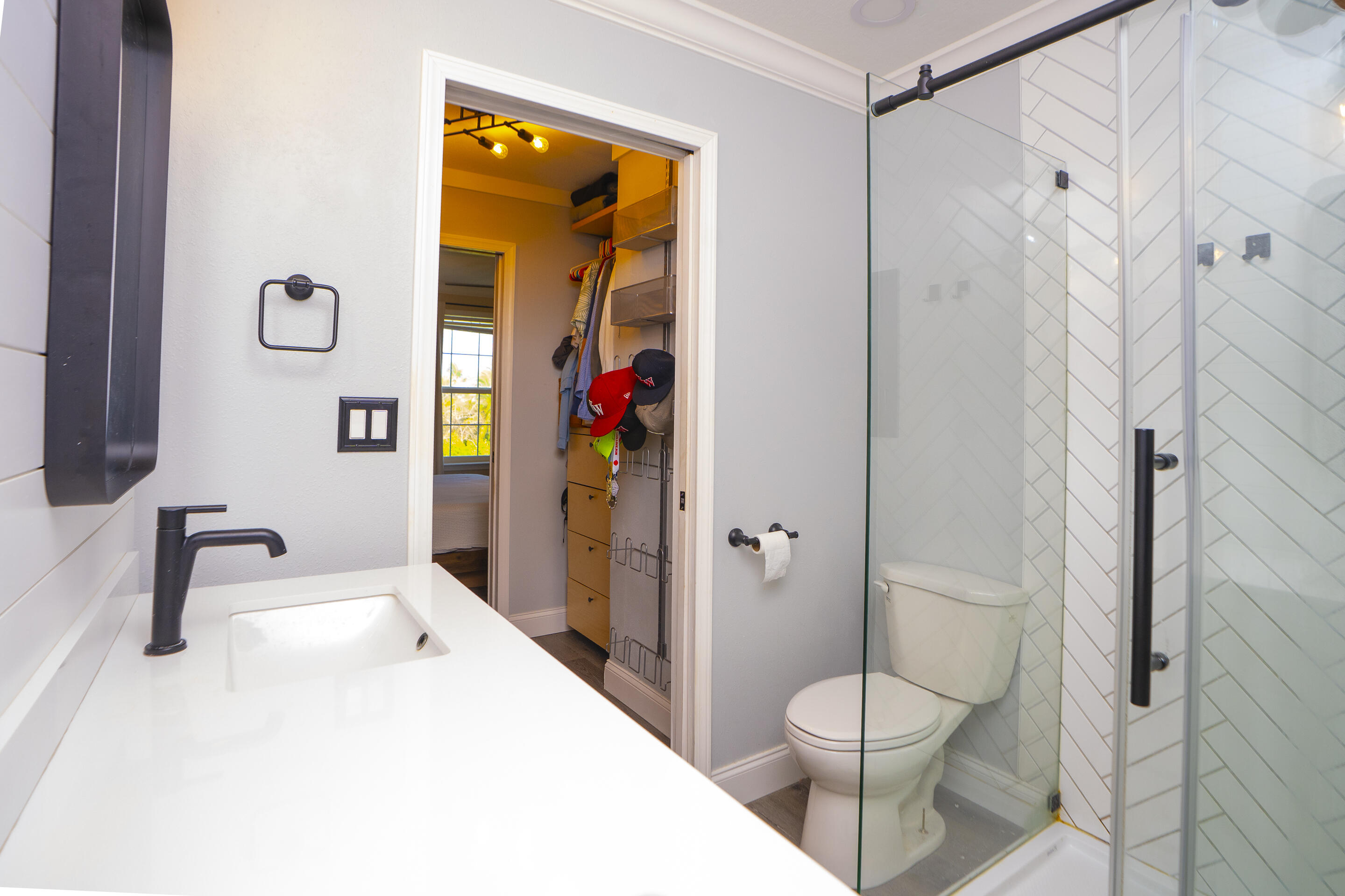 55 Ed Swift Road Key West, FL 33040 - Photo 12 of 23 a bathroom with a toilet sink and shower
