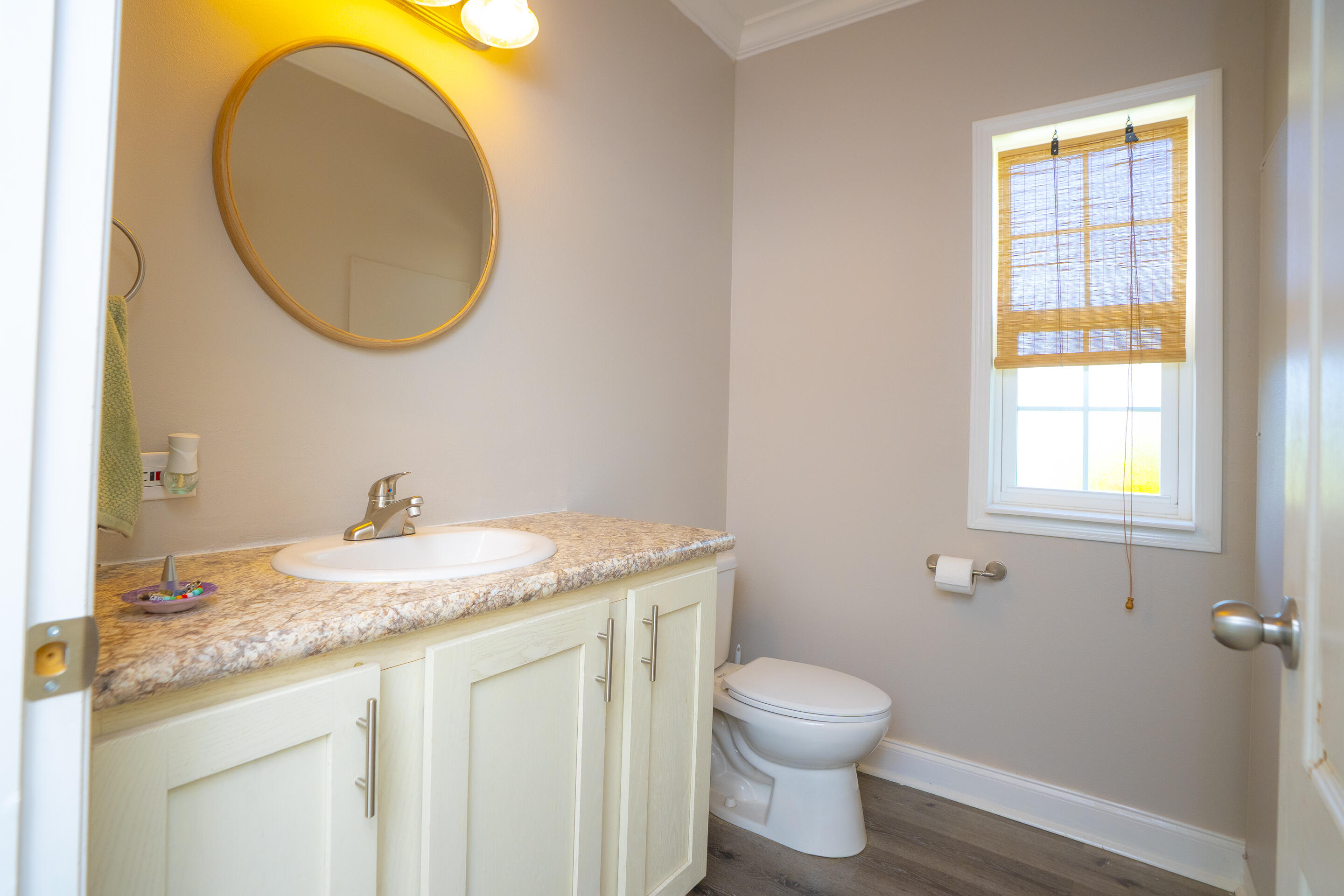 55 Ed Swift Road Key West, FL 33040 - Photo 17 of 23 a bathroom with a granite countertop toilet sink and mirror