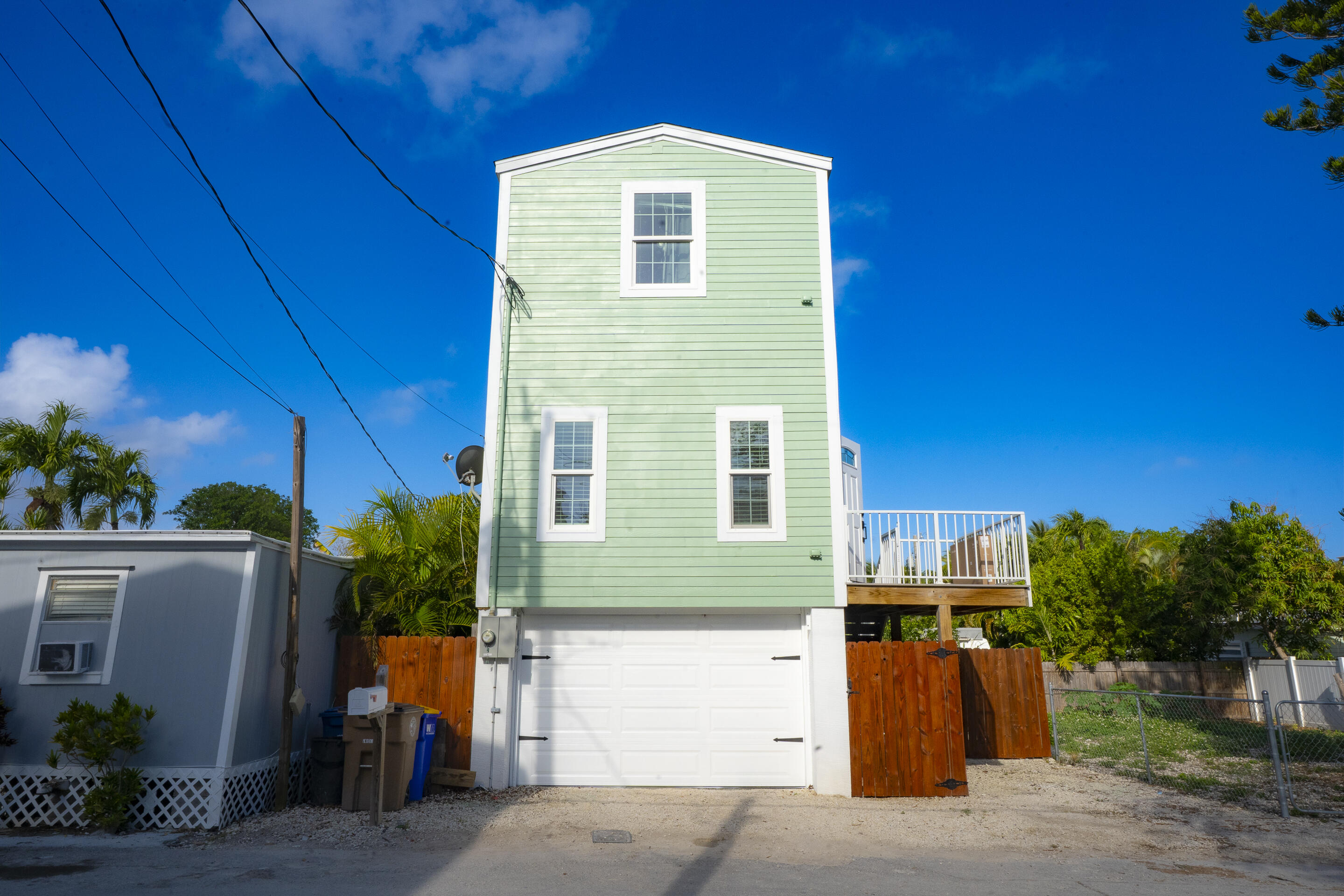 55 Ed Swift Road Key West, FL 33040 - Photo 22 of 23 a front view of a house with a yard
