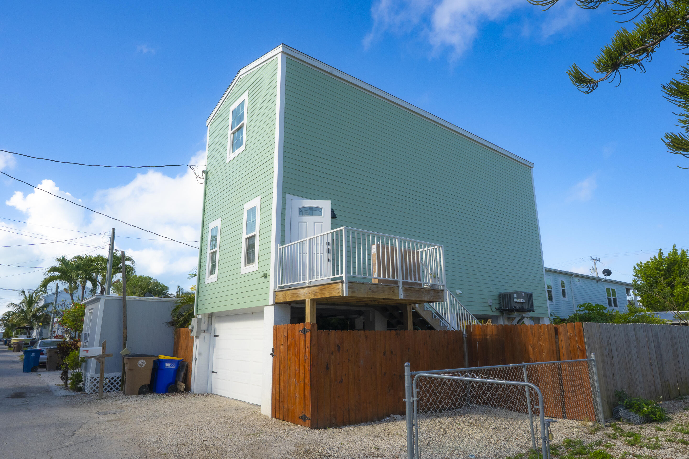 55 Ed Swift Road Key West, FL 33040 - Photo 3 of 23 a front view of a house with a yard