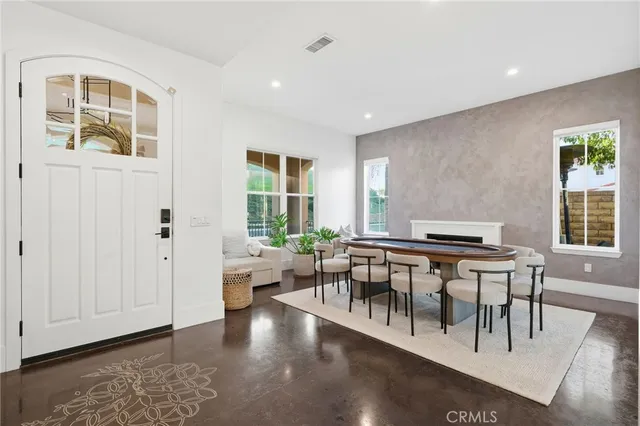 a view of a living room and dining room