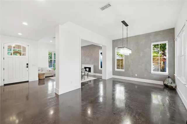 a living room with furniture and fireplace