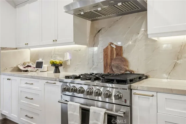 a bathroom with a sink a toilet and shower curtain