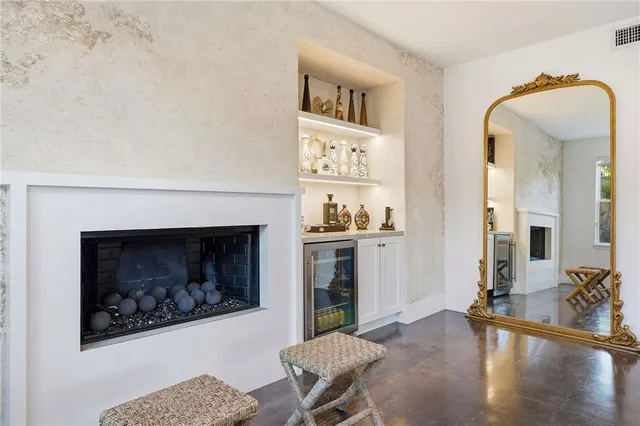 a bedroom with furniture and a gate