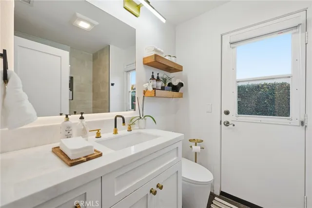 a view of cabinets with stainless steel appliances granite countertop white cabinets and a stove top oven