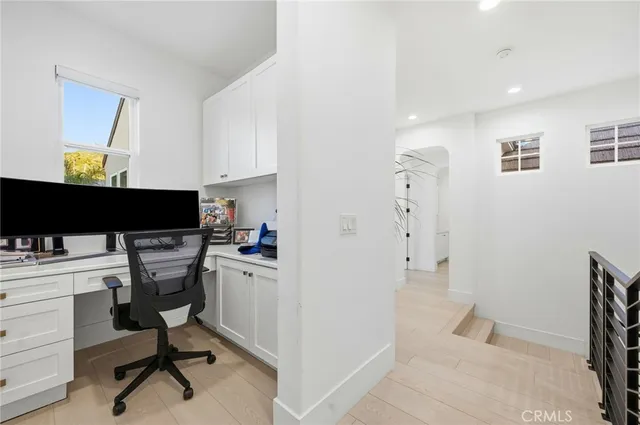a living room with furniture a table and a large window