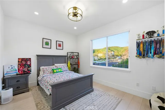 a white bath tub sitting in a bathroom next to a window