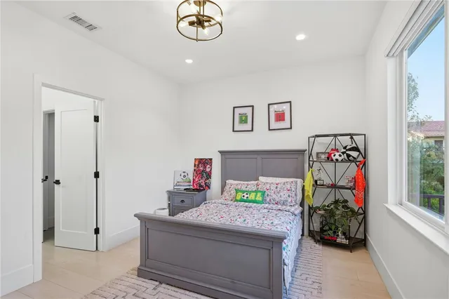 a bathroom with a double vanity sink mirror and shower