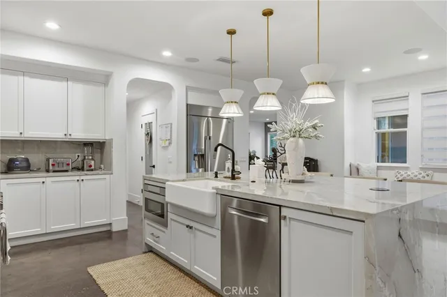 a view of a double vanity sink mirror and cabinets