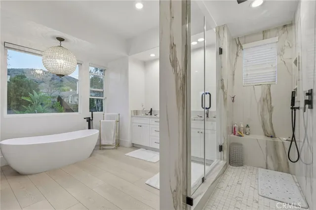 a bathroom with a bathtub and shower
