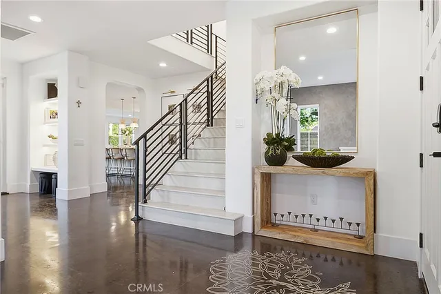 a view of empty room with wooden floor and fireplace