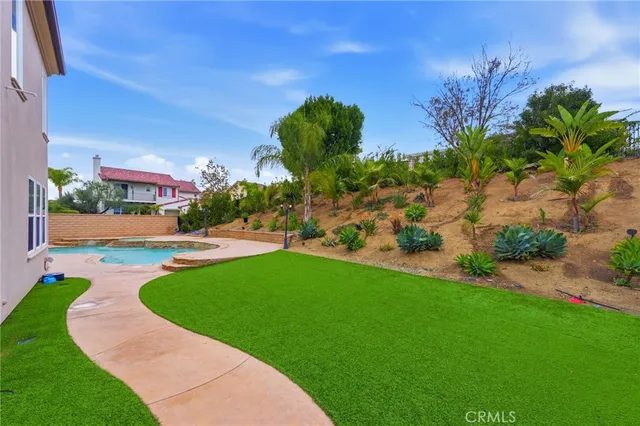 a view of a garden with a building in the background