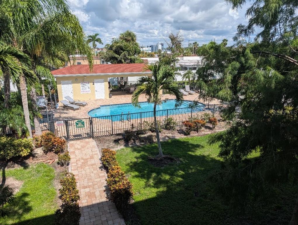 6394 Banyan Boulevard, Unit 204 New Port Richey, FL 34652 - Photo 19 of 25 a view of a town with brick building and large tree