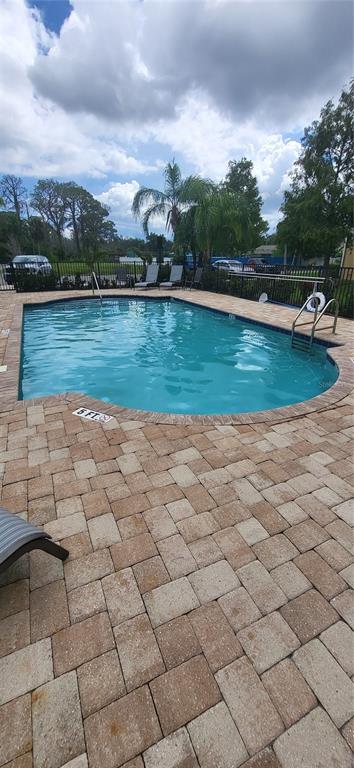 6394 Banyan Boulevard, Unit 204 New Port Richey, FL 34652 - Photo 20 of 25 a view of a lake with a yard
