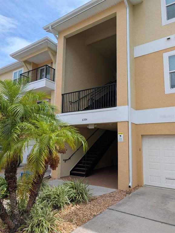 6394 Banyan Boulevard, Unit 204 New Port Richey, FL 34652 - Photo 3 of 25 a view of a house with a yard