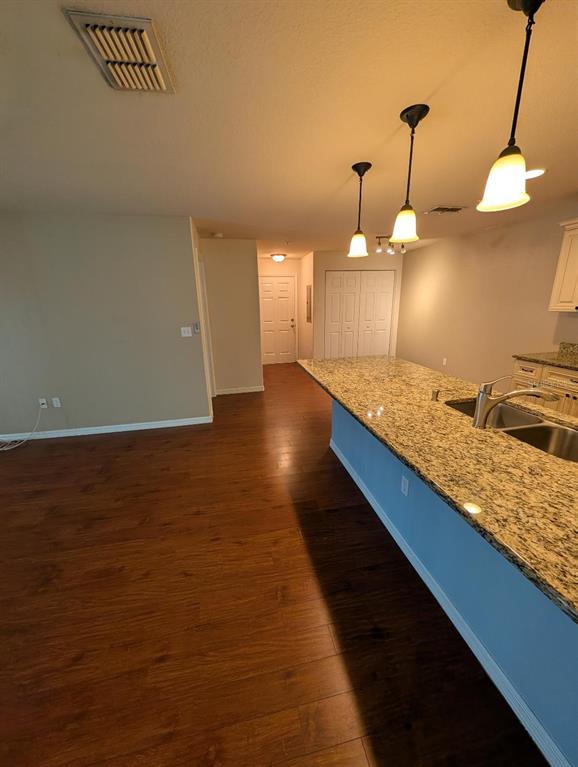 6394 Banyan Boulevard, Unit 204 New Port Richey, FL 34652 - Photo 7 of 25 a view of a room with a chandelier