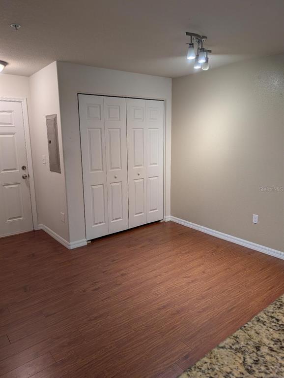 6394 Banyan Boulevard, Unit 204 New Port Richey, FL 34652 - Photo 9 of 25 a view of empty room with wooden floor