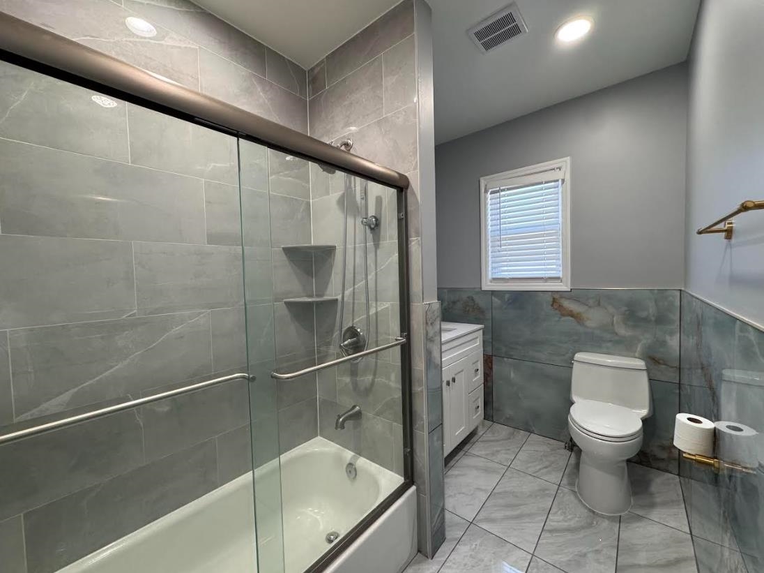 243 Hamilton Place, Unit 2 Hackensack, NJ 07601 - Photo 9 of 9 a bathroom with a toilet and a shower