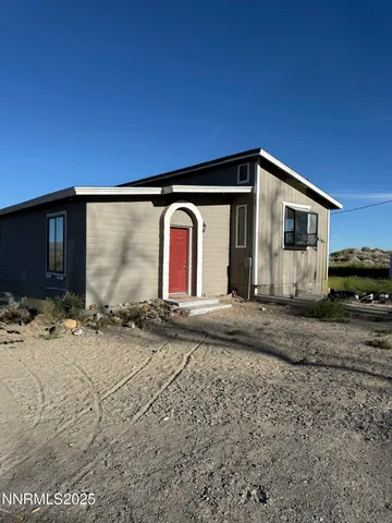 a house view with a backyard space
