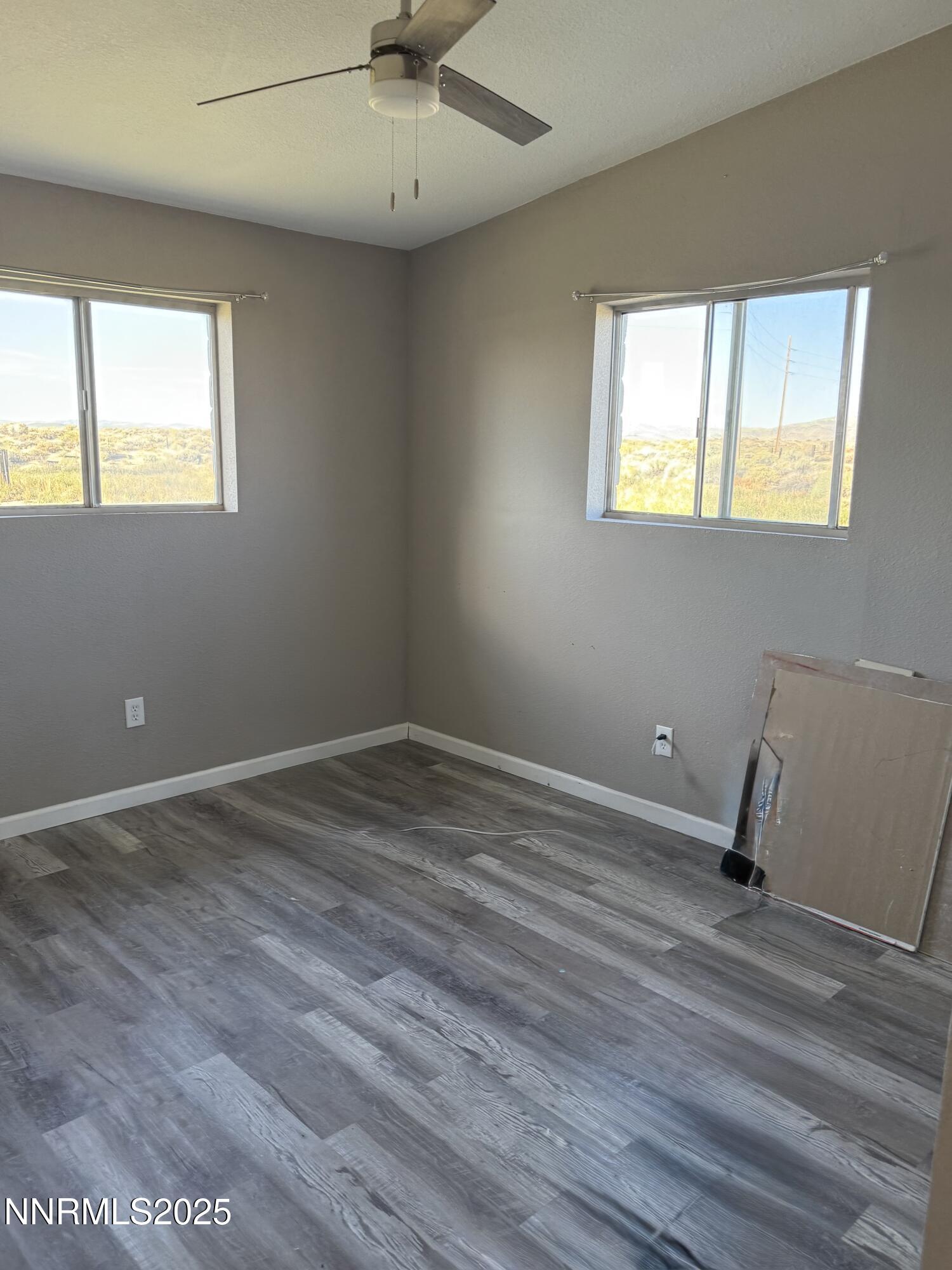 6722 Power Line Road Fallon, NV 89406 - Photo 11 of 15 a view of room with window and wooden floor