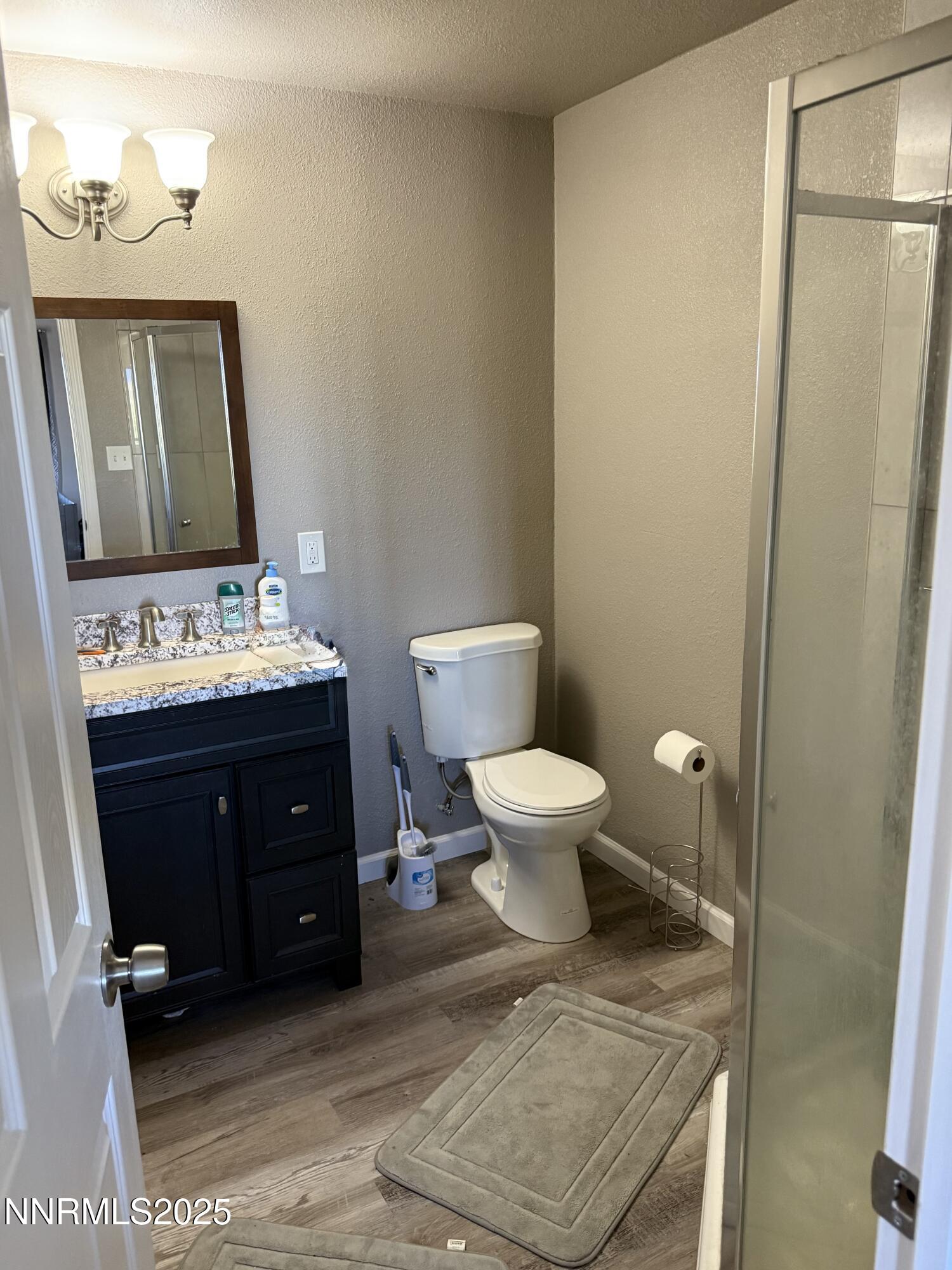 6722 Power Line Road Fallon, NV 89406 - Photo 13 of 15 a bathroom with a toilet sink and mirror