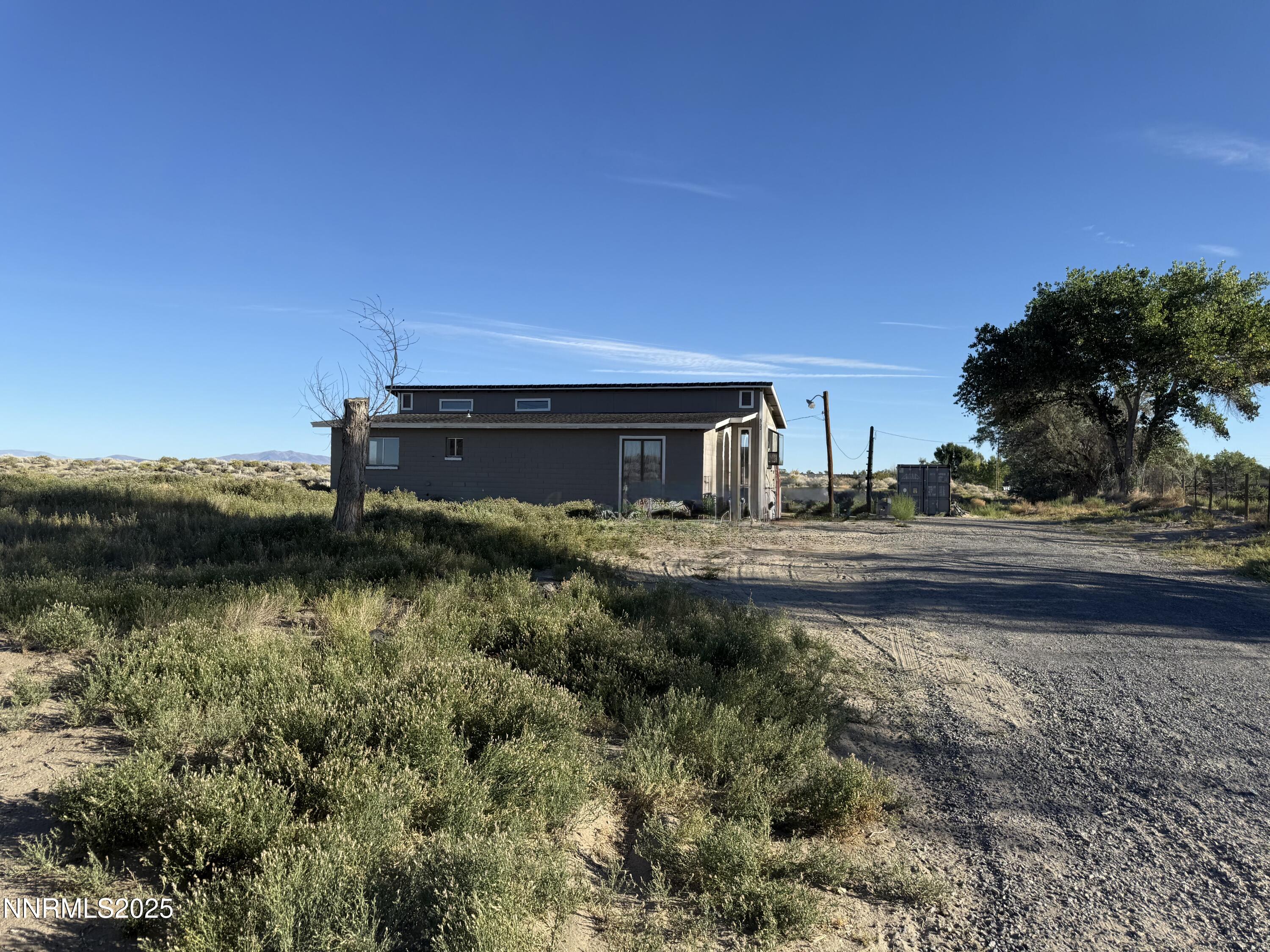 6722 Power Line Road Fallon, NV 89406 - Photo 4 of 15 a view of a lake with a house in the background
