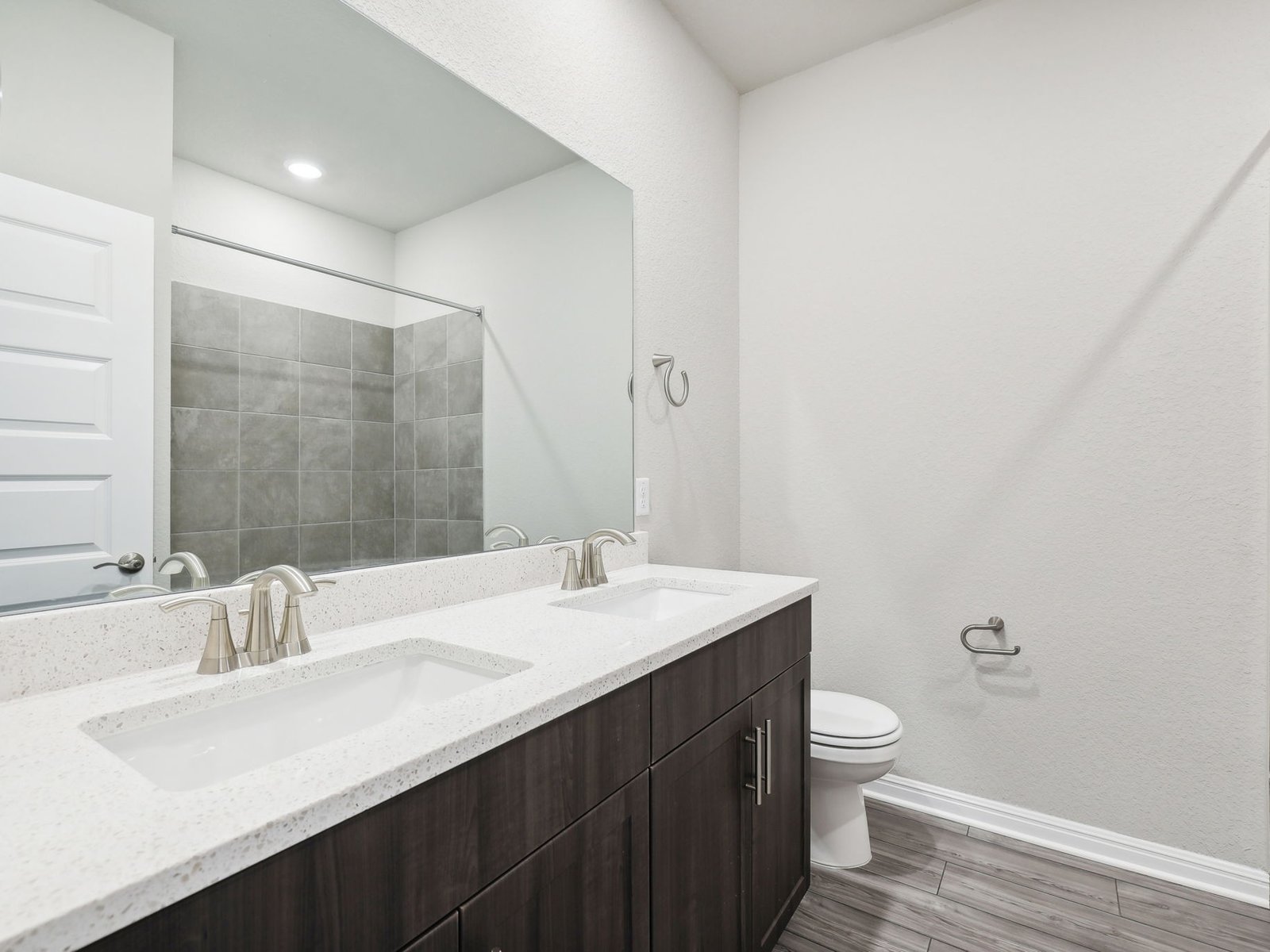 1812 South Main Street Kyle, TX 78640 - Photo 11 of 13 a bathroom with a sink and a mirror