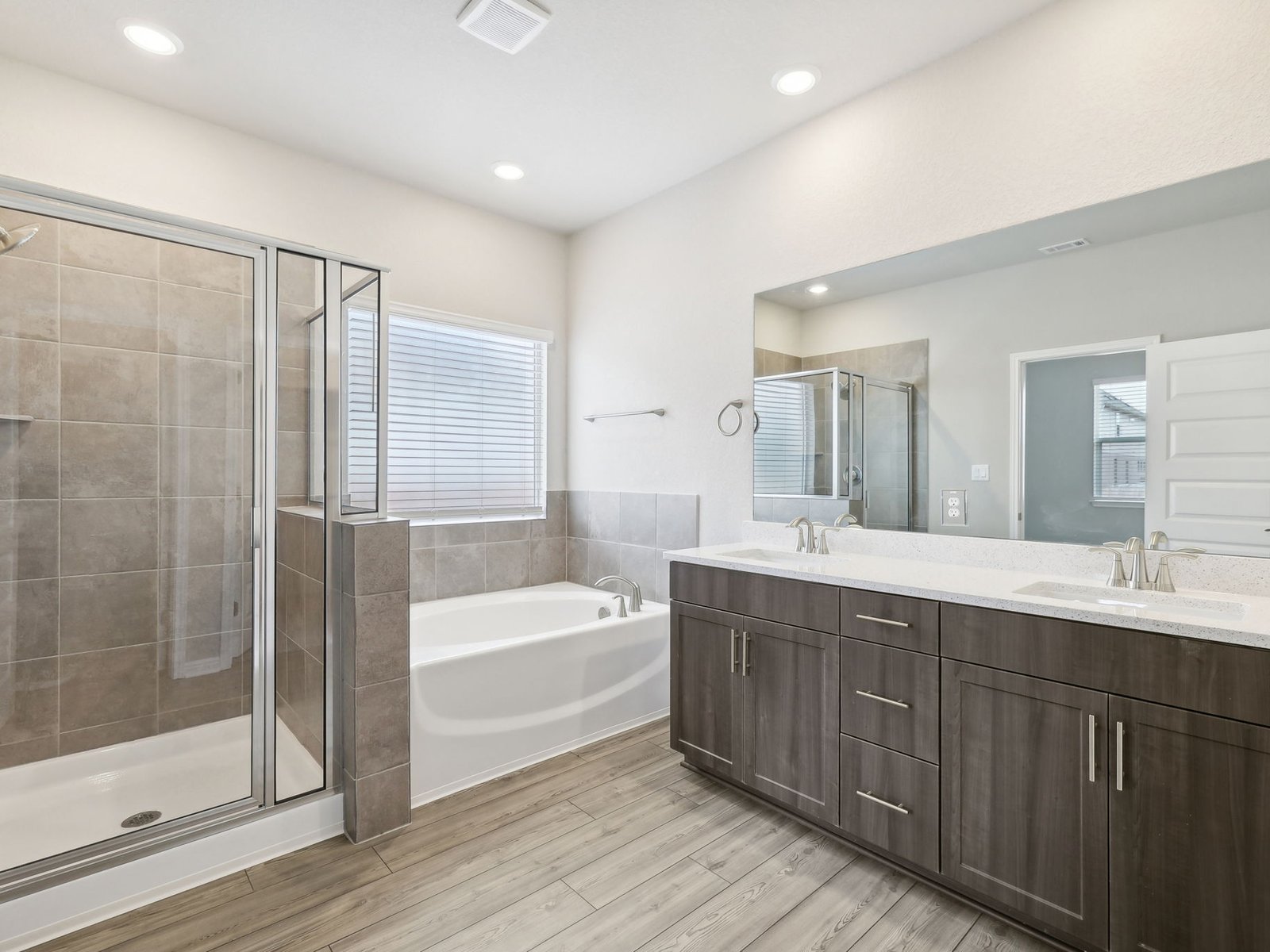 1812 South Main Street Kyle, TX 78640 - Photo 5 of 13 a bathroom with a tub sink shower and mirror