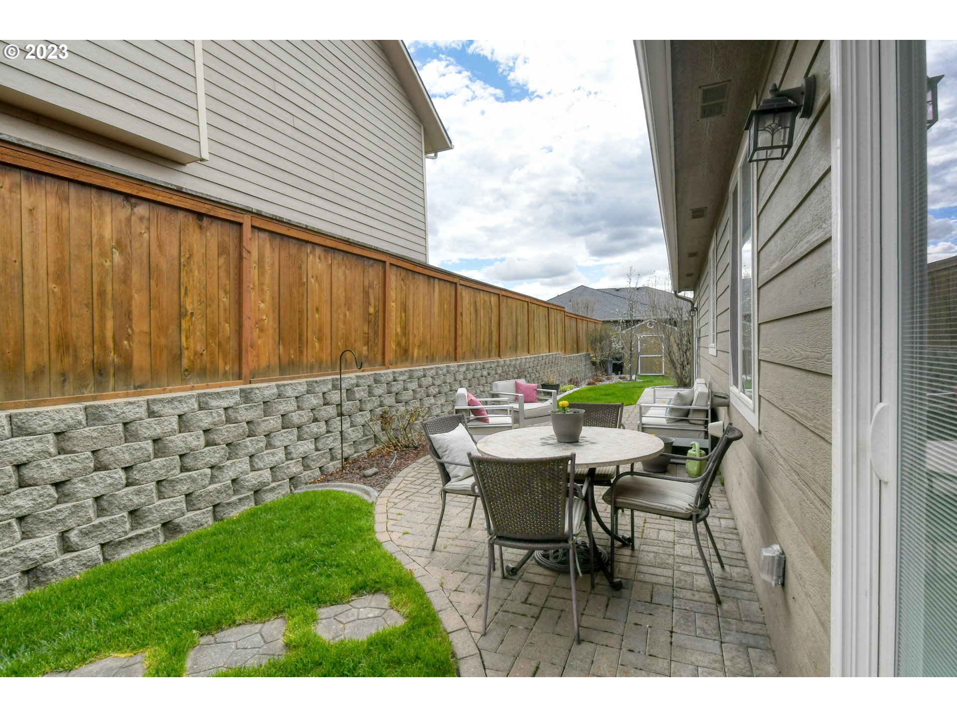 1821 Southwest 18th Street Pendleton, OR 97801 - Photo 24 of 29 a view of a patio with table and chairs and wooden fence