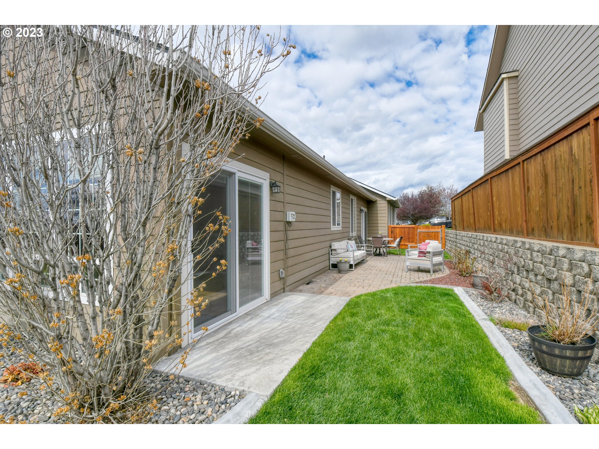 1821 Southwest 18th Street Pendleton, OR 97801 - Photo 3 of 29 a backyard of a house with table and chairs