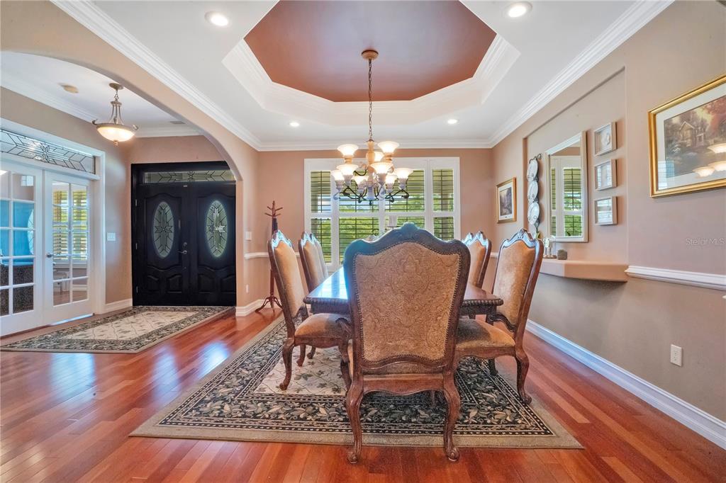 5785 Gilliam Road Orlando, FL 32818 - Photo 16 of 100 a view of a dining room with furniture window and wooden floor