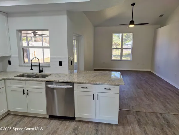 a view of room with window and hardwood floor