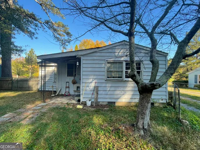 a backyard of a house with seating space