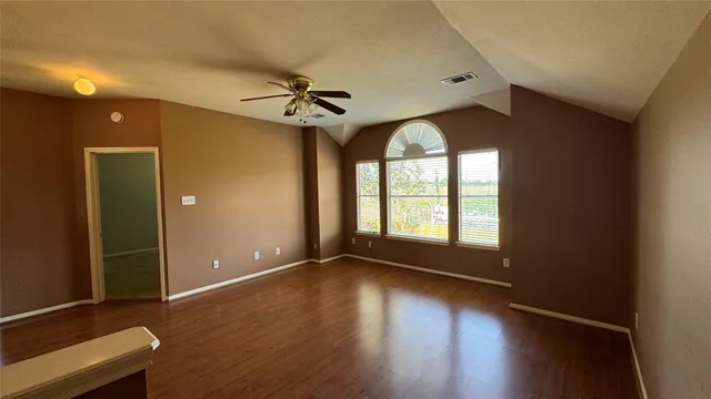 a view of room window and wooden floor