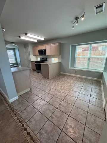 a view of kitchen with windows
