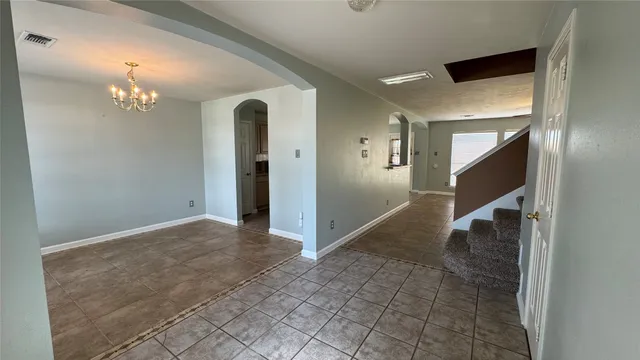 a view of a hallway view with staircase