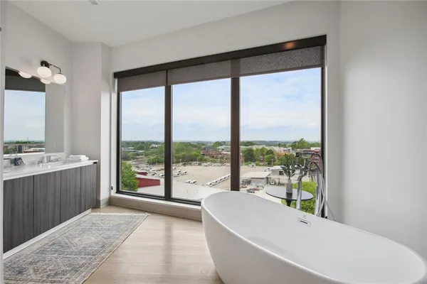 a living room with a large window and a table