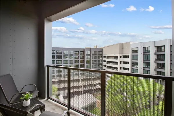 a view of a balcony with chair