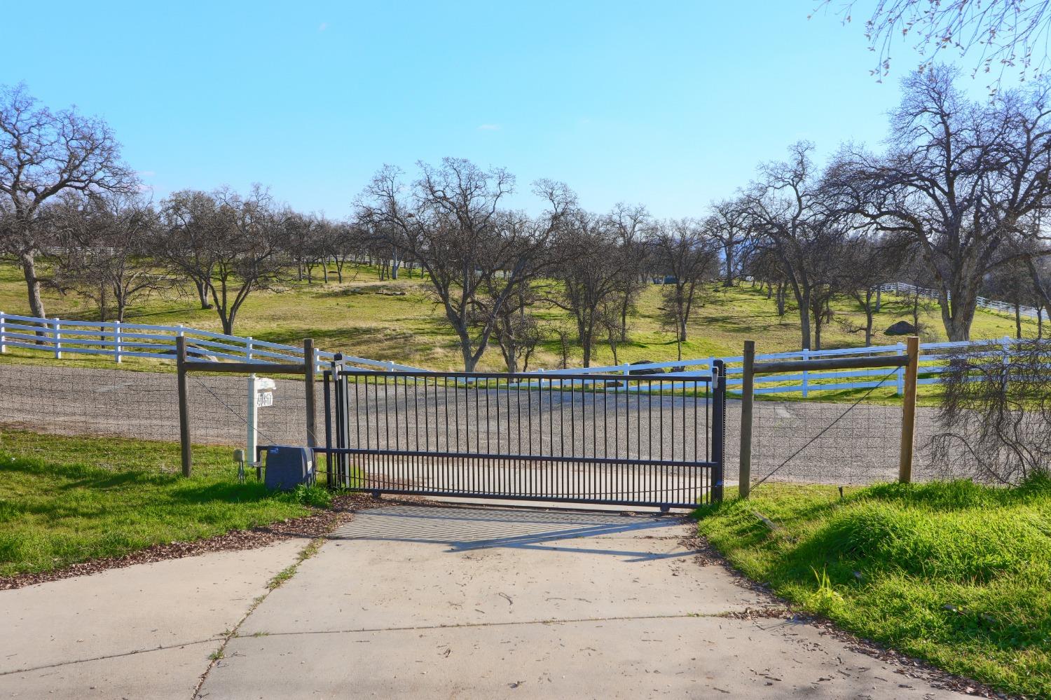 40817 Angus Road Coarsegold, CA 93614 - Photo 60 of 70 Main entry gate, property is completely fenced, horse potential