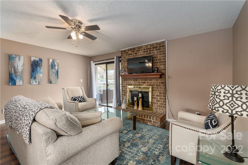 11054 Running Ridge Road Charlotte, NC 28226 - Photo 11 of 22 a living room with furniture and a fireplace