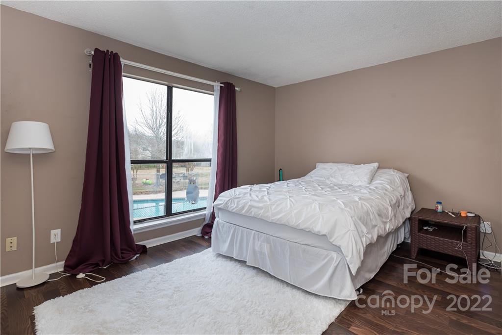 11054 Running Ridge Road Charlotte, NC 28226 - Photo 15 of 22 a bedroom with a bed and a window