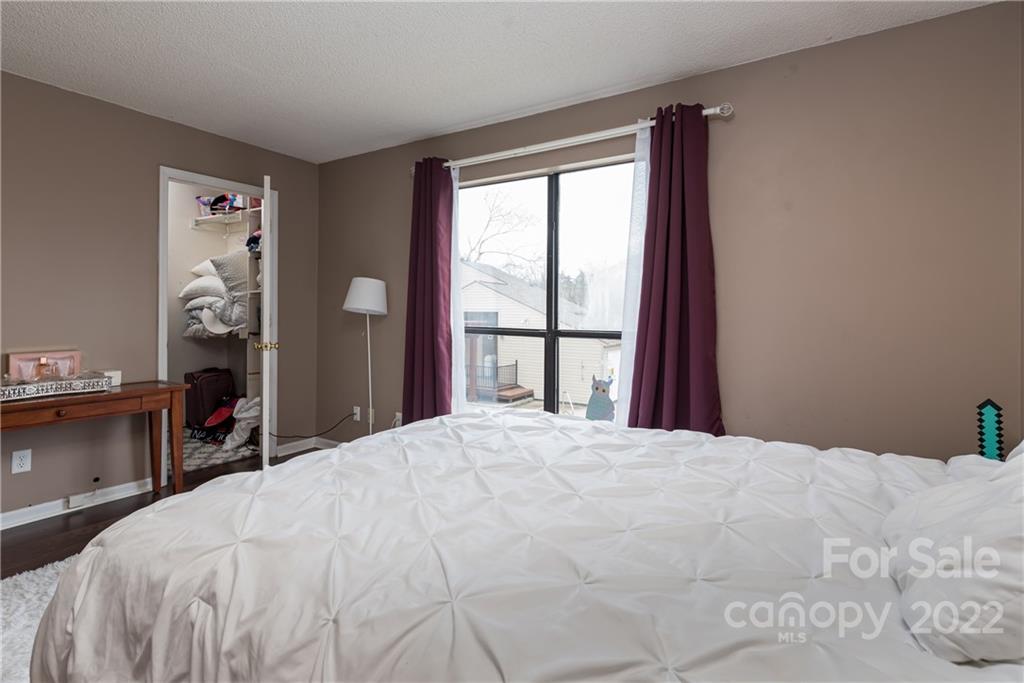 11054 Running Ridge Road Charlotte, NC 28226 - Photo 17 of 22 a bedroom with a bed and a large window