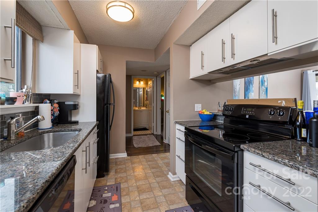 11054 Running Ridge Road Charlotte, NC 28226 - Photo 6 of 22 a kitchen with stainless steel appliances granite countertop a stove a sink and a refrigerator