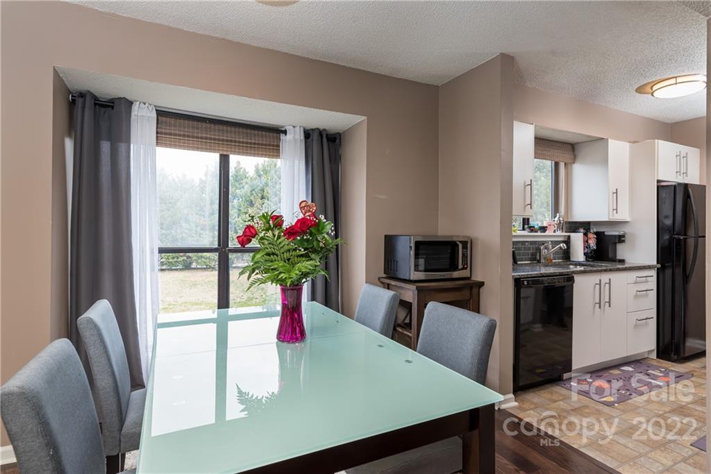 11054 Running Ridge Road Charlotte, NC 28226 - Photo 8 of 22 a kitchen with a table and chairs