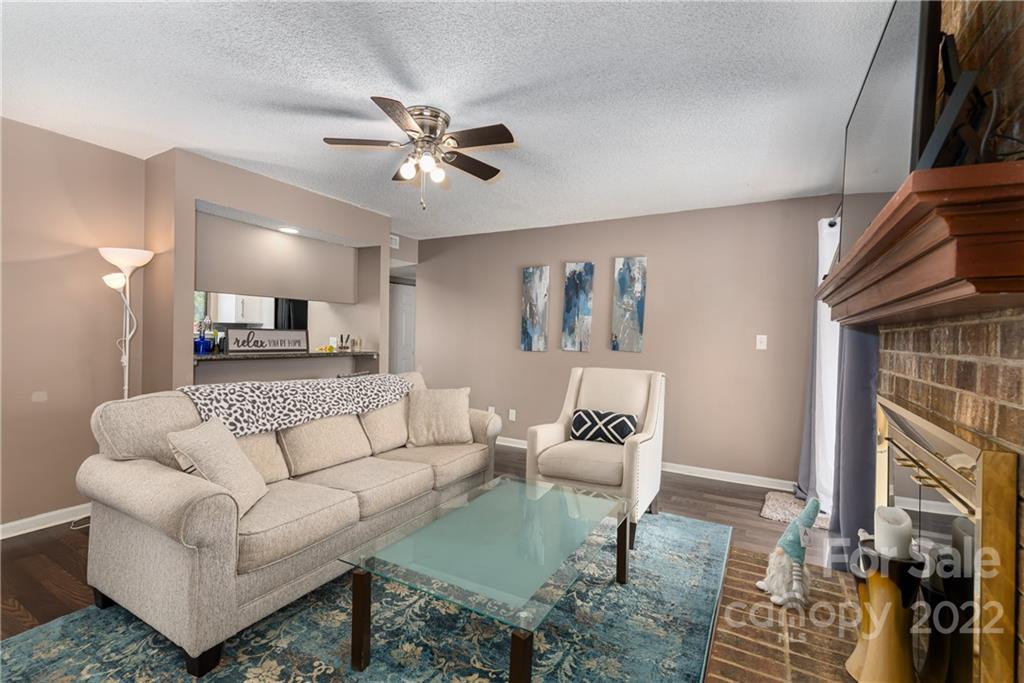 11054 Running Ridge Road Charlotte, NC 28226 - Photo 10 of 22 a living room with furniture and a fireplace