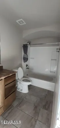 a bathroom with a sink a toilet and a shower