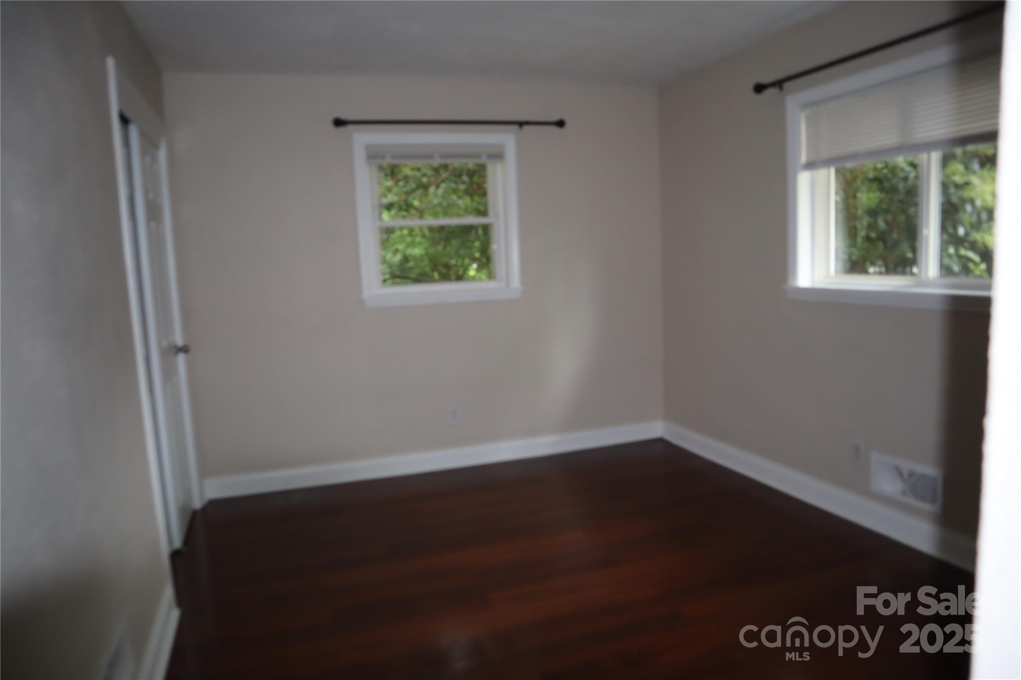 1703 Tyvola Road Charlotte, NC 28210 - Photo 11 of 17 an empty room with a window